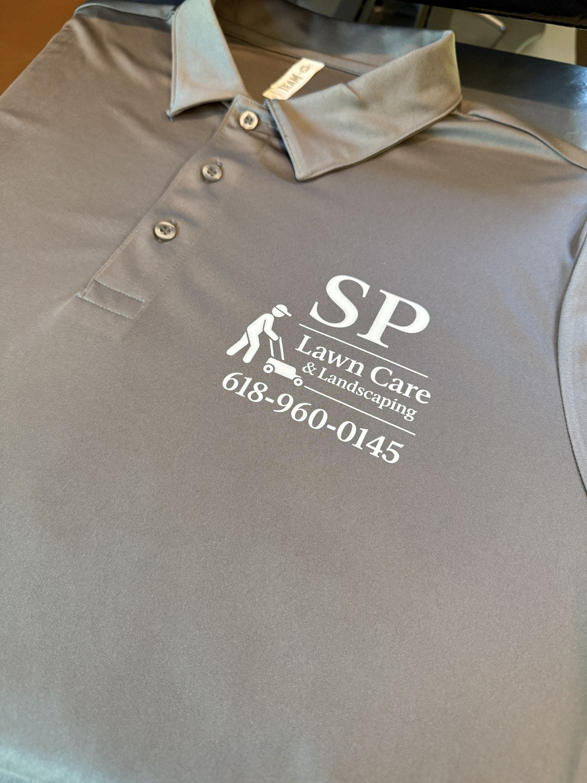SP Lawn Care business polo printed by Goshen Graphics